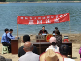 庭审后，1万尾鱼苗放生莲花湖